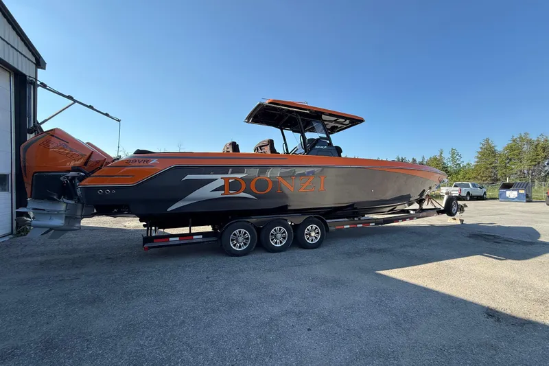 Slide: The Image of 2024 Donzi 39 VRZ boat on trailer, sleek design with orange accents. - 3