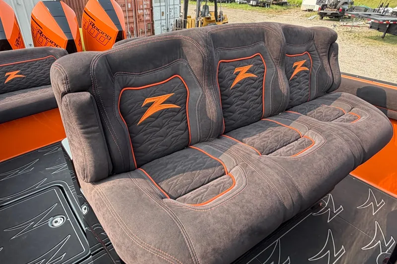 Slide: The Image of 2024 Donzi 39 VRZ boat seating with orange accents and logo detailing. - 44