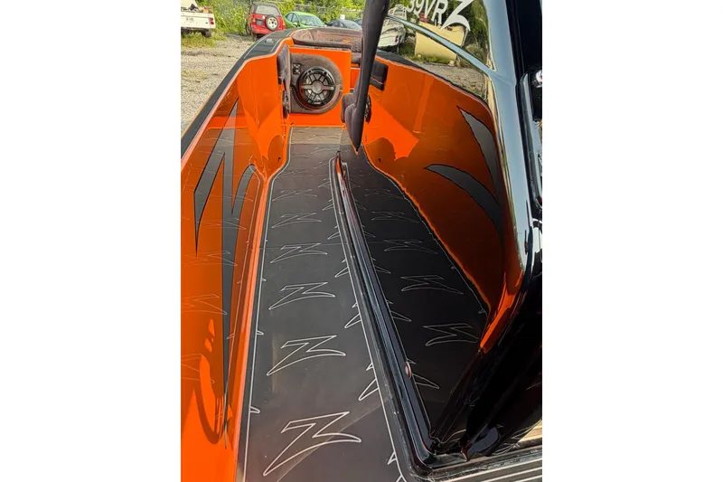 Slide: The Image of 2024 Donzi 39 VRZ boat interior with sleek orange and black design. - 53