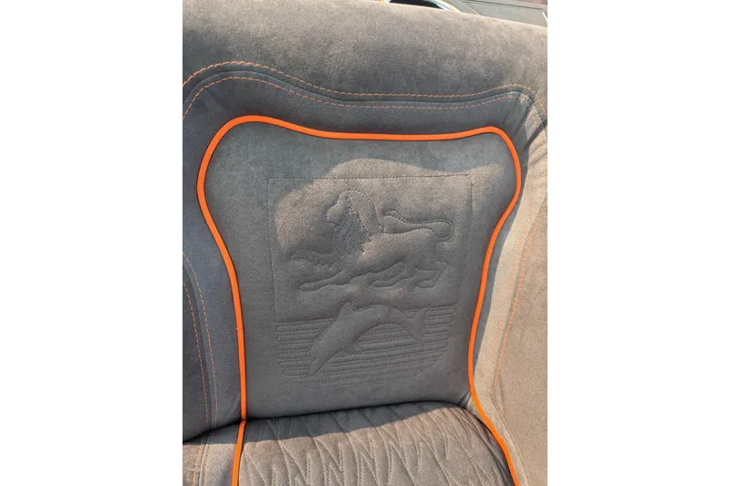 Slide: The Image of 2024 Donzi 39 VRZ seat with embossed design and orange trim detailing. - 31