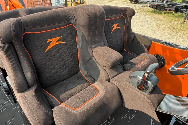 Slide: The Image of 2024 Donzi 39 VRZ boat interior with plush seats and orange accents. - 40