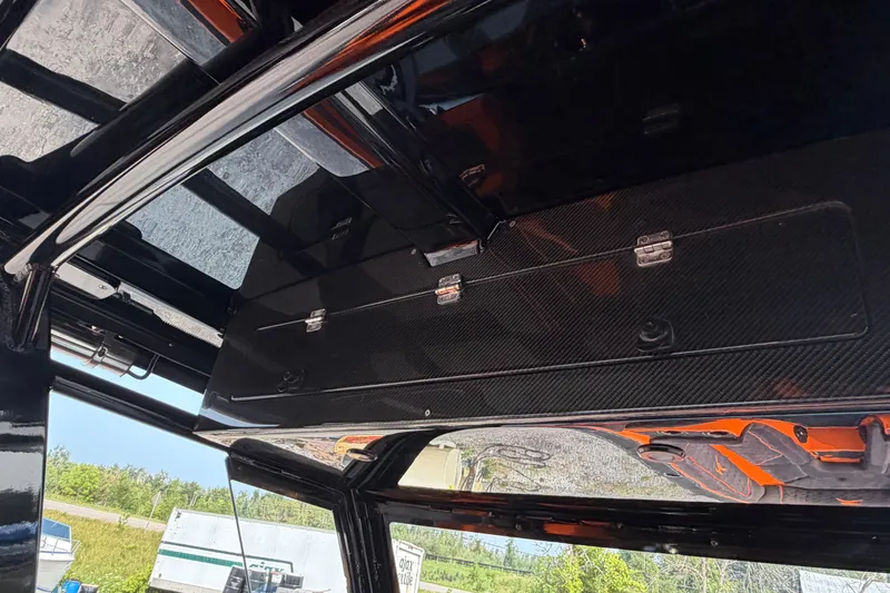 Slide: The Image of Interior view of 2024 Donzi 39 VRZ boat, showcasing sleek carbon fiber detailing. - 42