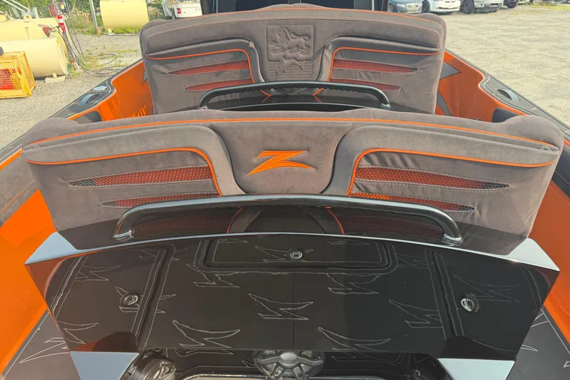 Slide: The Image of 2024 Donzi 39 VRZ boat interior with sleek orange and gray seating design. - 21