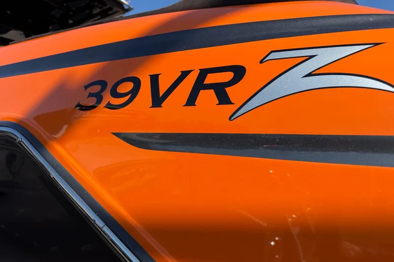 Slide: The Image of 2024 Donzi 39 VRZ boat, vibrant orange exterior with sleek design details. - 6