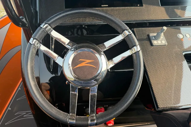 Slide: The Image of Steering wheel of 2024 Donzi 39 VRZ boat with carbon fiber dashboard. - 23