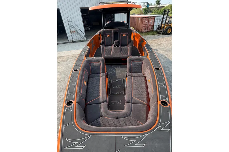 Slide: The Image of 2024 Donzi 39 VRZ boat interior with sleek orange and gray seating design. - 35
