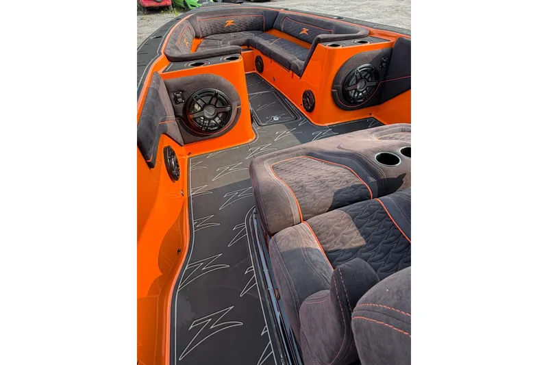 Slide: The Image of 2024 Donzi 39 VRZ boat interior with orange accents and plush seating. - 55
