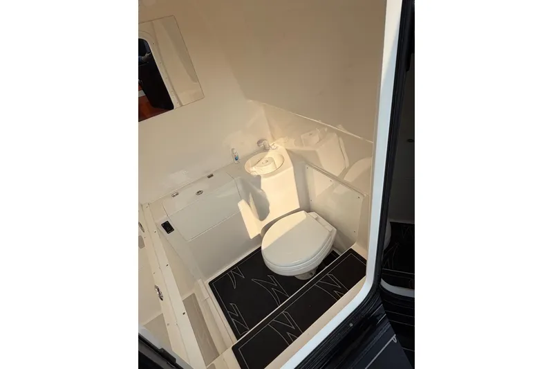 Slide: The Image of 2024 Donzi 39 VRZ boat interior bathroom with toilet and sink. - 38