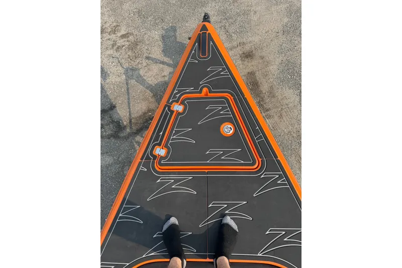 Slide: The Image of Bow view of 2024 Donzi 39 VRZ boat with orange and black deck design. - 34
