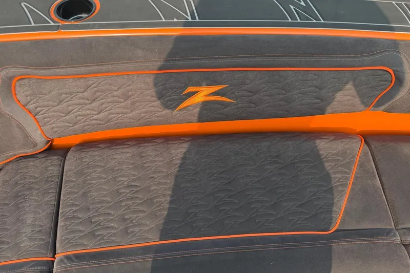 Slide: The Image of 2024 Donzi 39 VRZ boat interior with orange accents and logo detailing. - 32