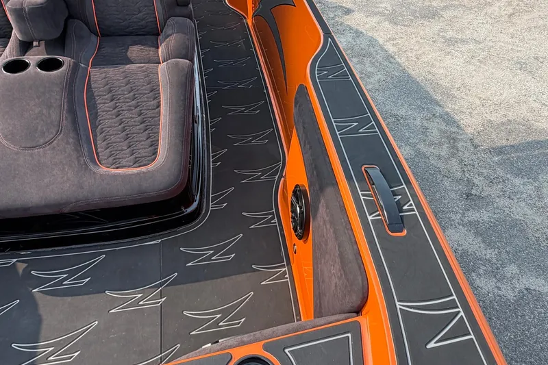 Slide: The Image of 2024 Donzi 39 VRZ boat interior with orange accents and custom seating. - 36