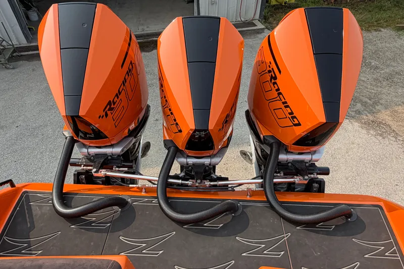 Slide: The Image of Triple orange outboard engines on a 2024 Donzi 39 VRZ boat. - 46