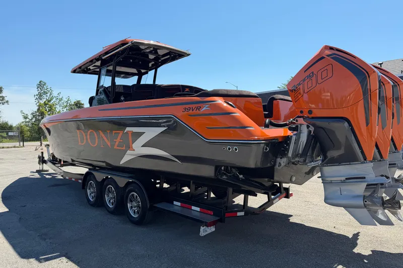 Slide: The Image of 2024 Donzi 39 VRZ boat with triple outboard engines on a trailer. - 12