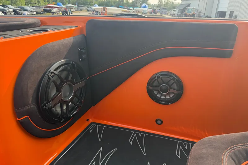 Slide: The Image of Interior of 2024 Donzi 39 VRZ boat with orange and black speaker system. - 29