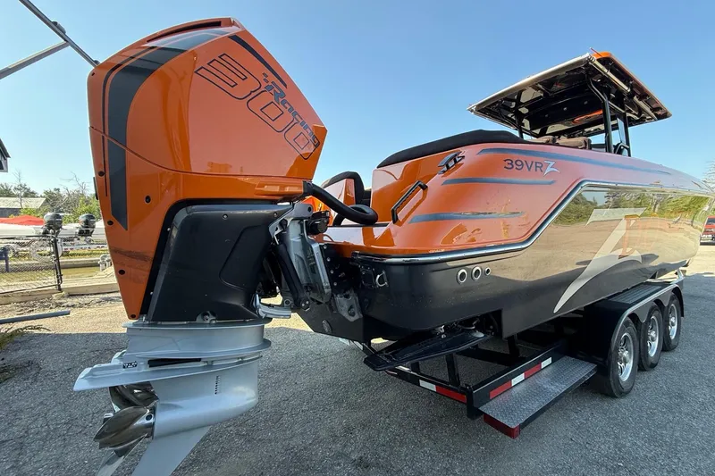 Slide: The Image of 2024 Donzi 39 VRZ boat with orange and black design on a trailer. - 4
