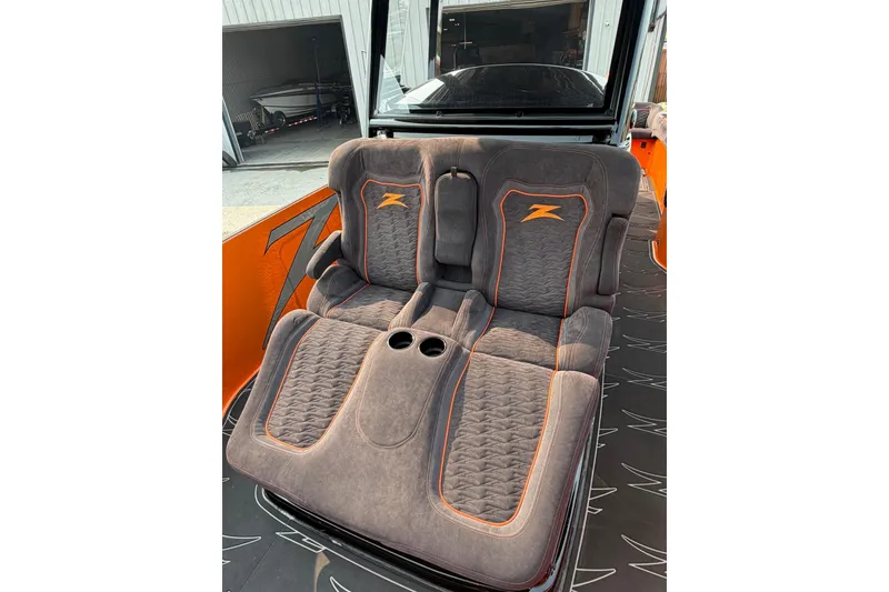 Slide: The Image of Luxurious seating in the 2024 Donzi 39 VRZ boat, featuring stylish orange accents. - 56