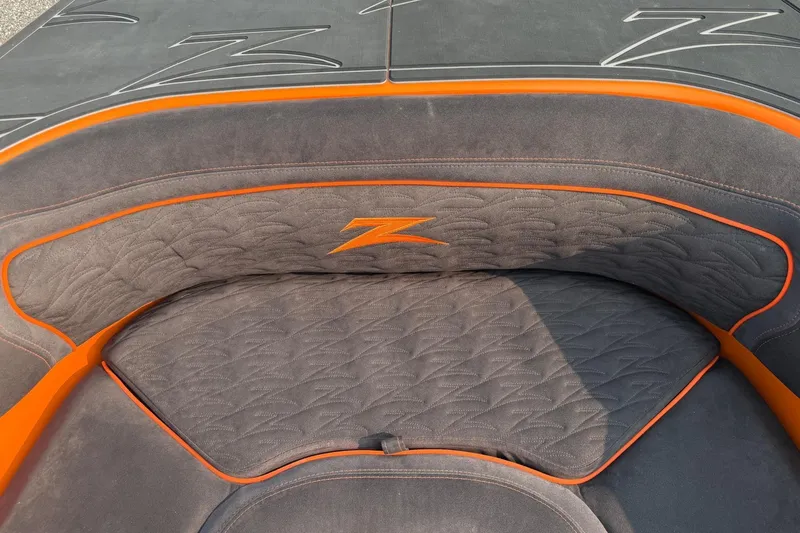 Slide: The Image of 2024 Donzi 39 VRZ boat interior with orange accents and logo detailing. - 33