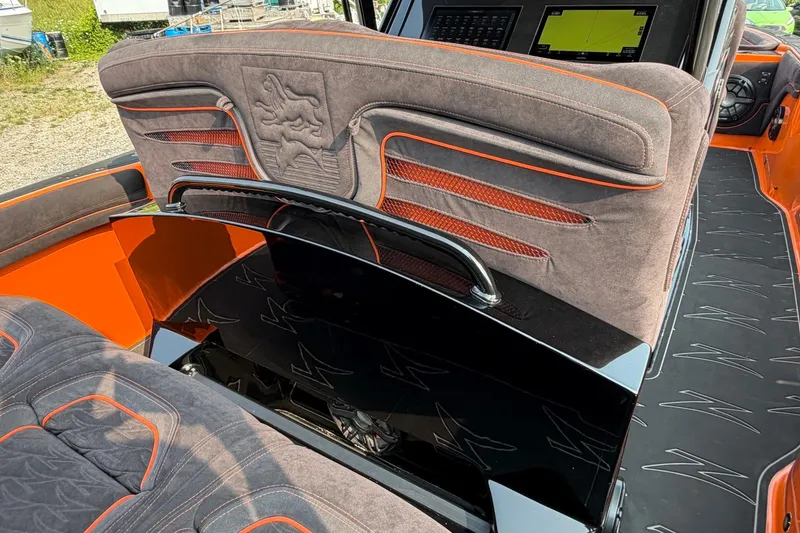 Slide: The Image of 2024 Donzi 39 VRZ boat interior with plush seating and modern dashboard. - 45