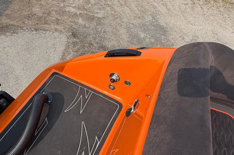 Slide: The Image of 2024 Donzi 39 VRZ boat, orange deck, sleek design, luxury seating, and modern features. - 47