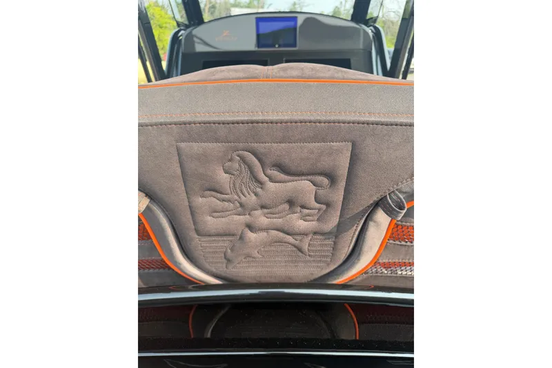 Slide: The Image of 2024 Donzi 39 VRZ boat interior with embroidered lion design on seat. - 22