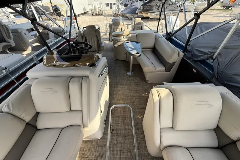 Slide: The Image of Luxurious interior of a 2016 Bennington 2550 RBR pontoon boat with plush seating. - 14
