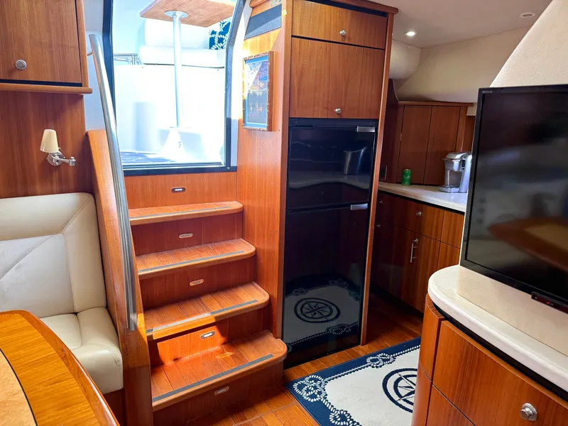 Slide: The Image of Interior of a 2006 Tiara Yachts 4300 Sovran with wooden cabinetry and stairs. - 40