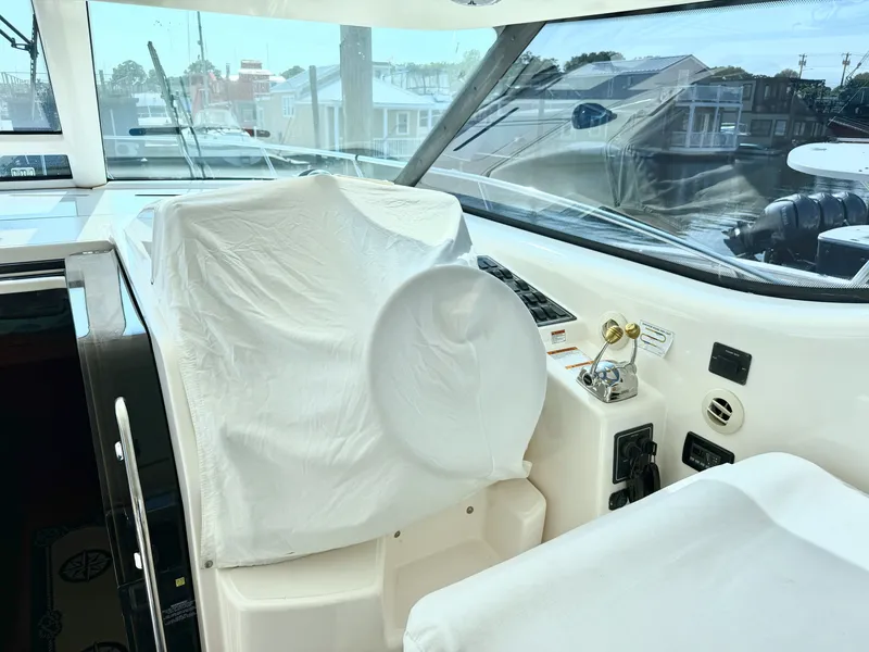 Slide: The Image of The cockpit of a 2006 Tiara Yachts 4300 Sovran with a covered helm station. - 20