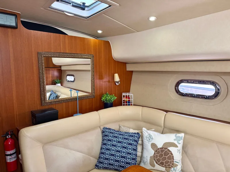 Slide: The Image of Interior of a 2006 Tiara Yachts 4300 Sovran with beige sofa and decorative pillows. - 37