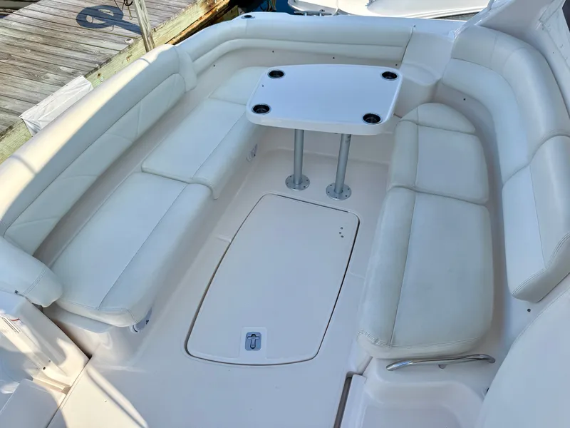 Slide: The Image of The 2006 Tiara Yachts 4300 Sovran features a spacious white seating area with a table. - 12