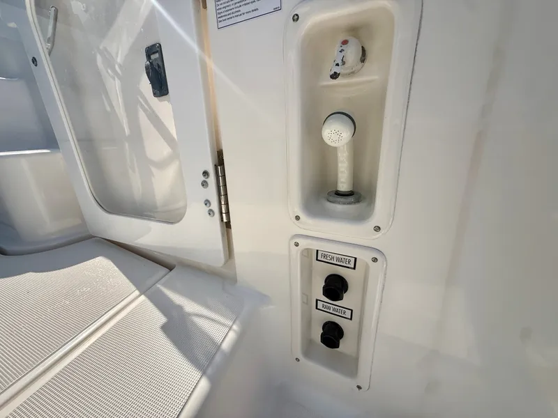 Slide: The Image of Close-up of a water hose and controls on a 2006 Tiara Yachts 4300 Sovran. - 11
