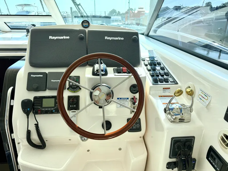 Slide: The Image of The image shows the helm of a 2006 Tiara Yachts 4300 Sovran with Raymarine equipment. - 30