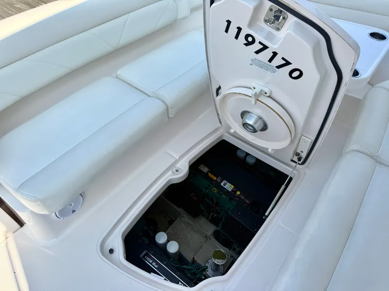Slide: The Image of The image shows the engine compartment of a 2006 Tiara Yachts 4300 Sovran with an open hatch. - 15