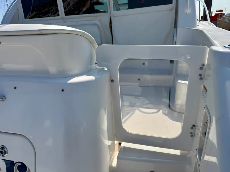 Slide: The Image of The 2006 Tiara Yachts 4300 Sovran features an open door leading to the cabin. - 16