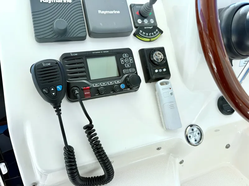 Slide: The Image of The image shows the helm of a 2006 Tiara Yachts 4300 Sovran with various navigation equipment. - 33
