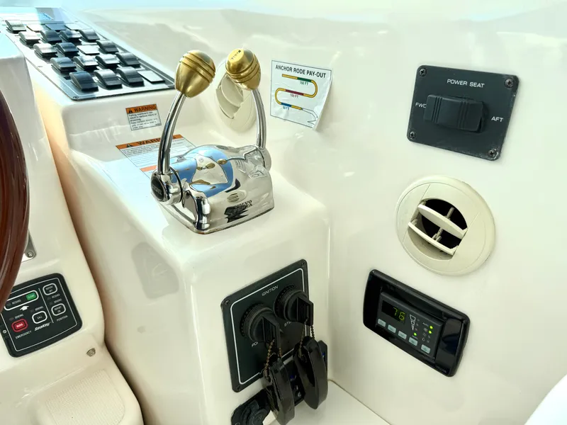 Slide: The Image of The image shows the helm of a 2006 Tiara Yachts 4300 Sovran with controls and gauges. - 31