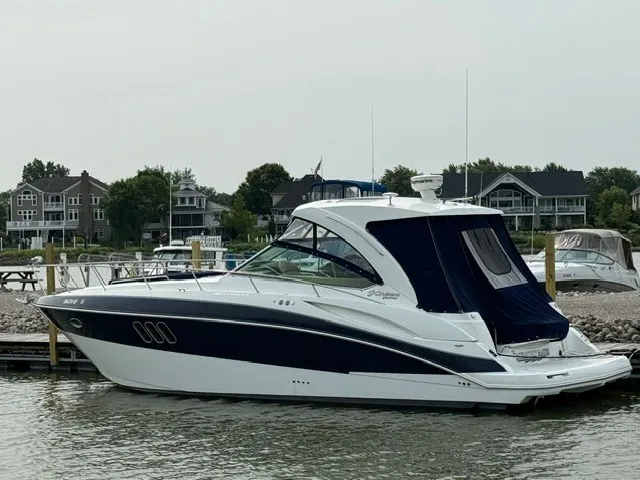 The Image of A 2013 Cruisers Yachts 380 Express docked at a marina, featuring a sleek, modern design. - 0