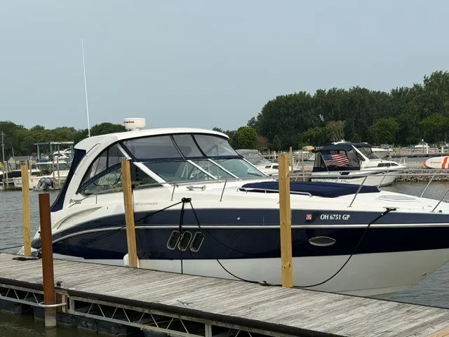 Slide: The Image of A 2013 Cruisers Yachts 380 Express docked. It features a sleek design. - 1