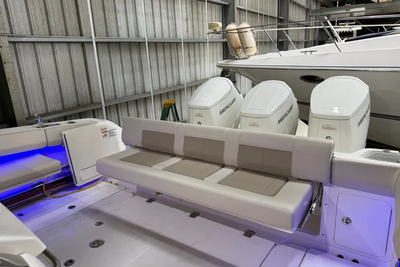Slide: The Image of 2024 Boston Whaler 420 Outrage boat with Mercury engines, featuring spacious seating and modern design. - 15