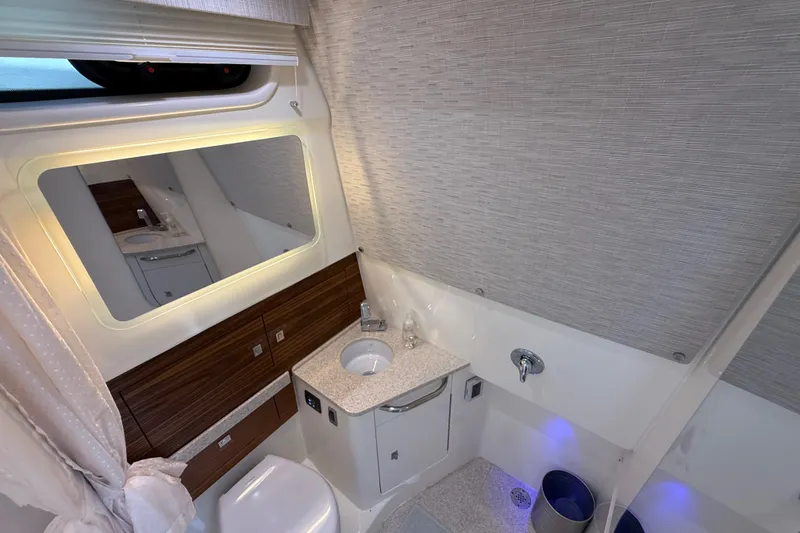 Slide: The Image of Luxurious bathroom interior of 2024 Boston Whaler 420 Outrage yacht, featuring modern fixtures and elegant design. - 80