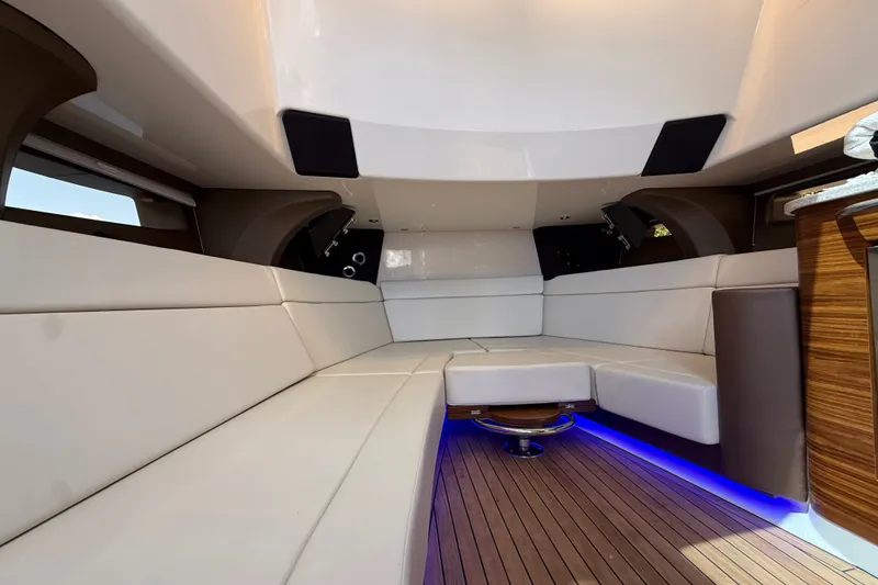 Slide: The Image of Luxurious interior of 2024 Boston Whaler 420 Outrage with elegant seating and ambient lighting. - 75