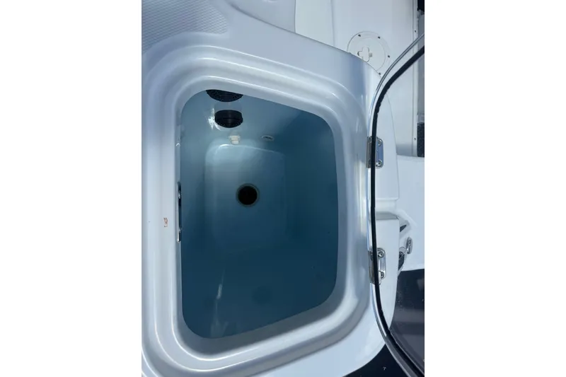 Slide: The Image of Livewell compartment on 2024 Boston Whaler 420 Outrage boat, open lid view. - 53
