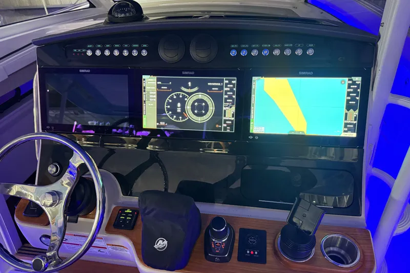 Slide: The Image of Dashboard of 2024 Boston Whaler 420 Outrage with advanced navigation displays. - 11