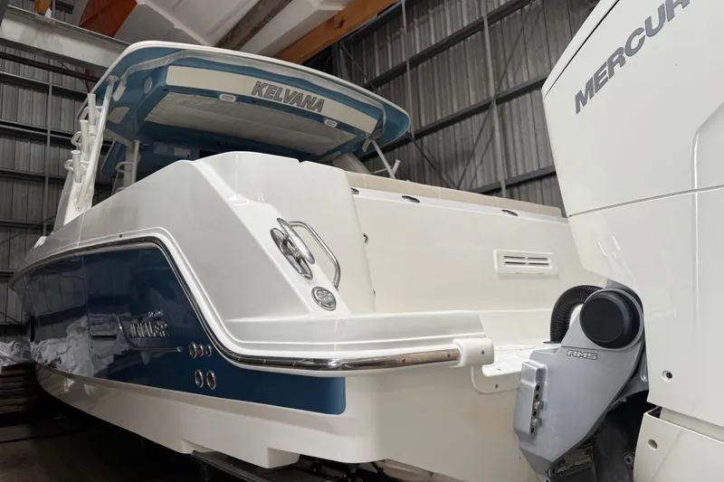 Slide: The Image of 2024 Boston Whaler 420 Outrage boat in storage, featuring Mercury engine. - 30