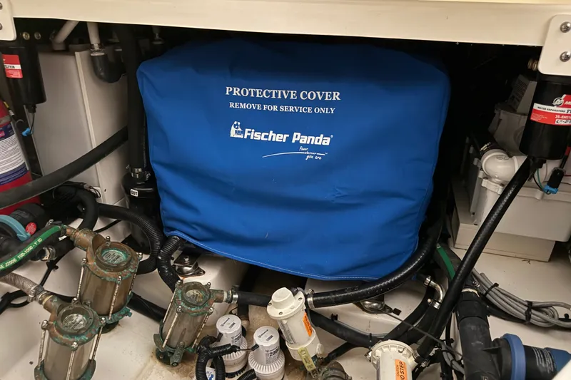 Slide: The Image of Engine compartment of 2024 Boston Whaler 420 Outrage with Fischer Panda protective cover. - 36