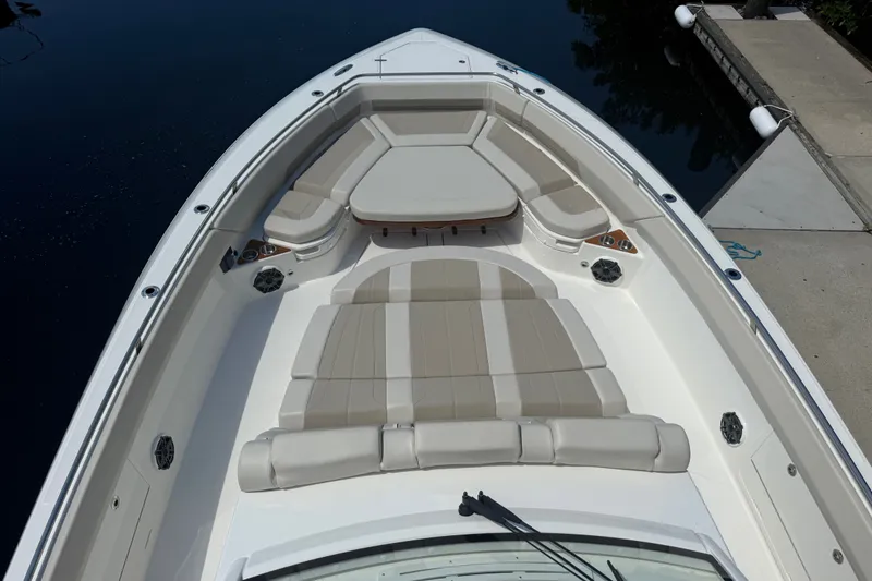 Slide: The Image of 2024 Boston Whaler 420 Outrage boat with spacious, luxurious seating on deck. - 66