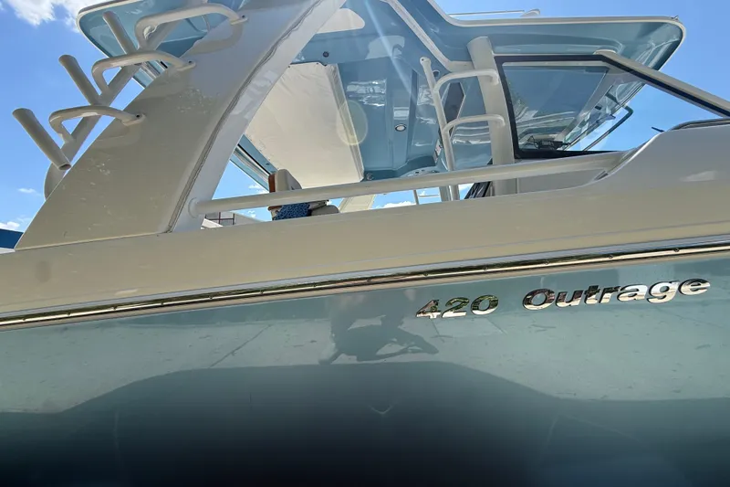 Slide: The Image of 2024 Boston Whaler 420 Outrage boat, showcasing sleek design and modern features. - 49