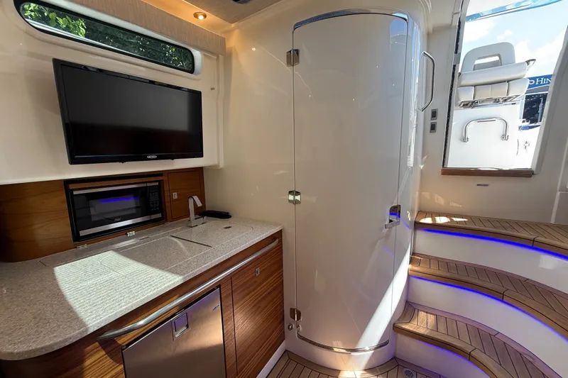 Slide: The Image of Luxurious interior of 2024 Boston Whaler 420 Outrage with kitchenette and modern amenities. - 74