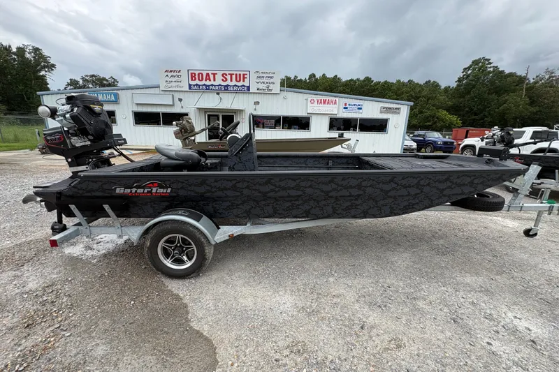 Slide: The Image of 2026 Gator Tail 1860 CC Extreme boat on trailer at dealership. - 3