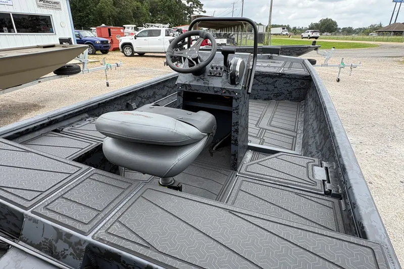 Slide: The Image of 2026 Gator Tail 1860 CC Extreme boat interior with steering console and seating. - 5