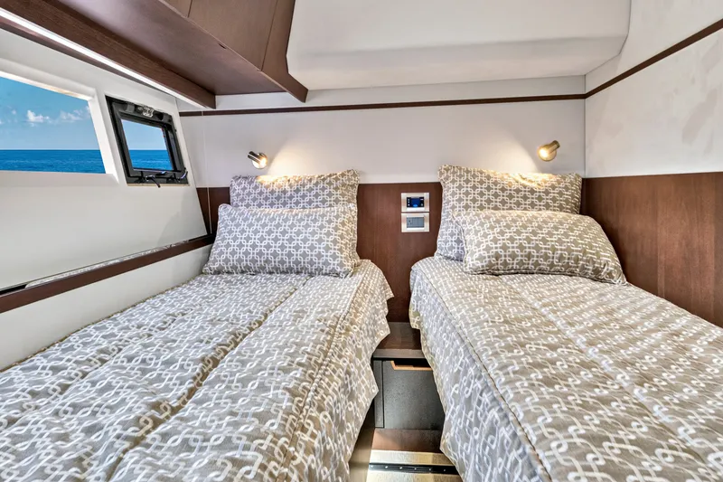 Slide: The Image of Twin beds in a 2017 Galeon 560 Sky yacht cabin with ocean view. - 32